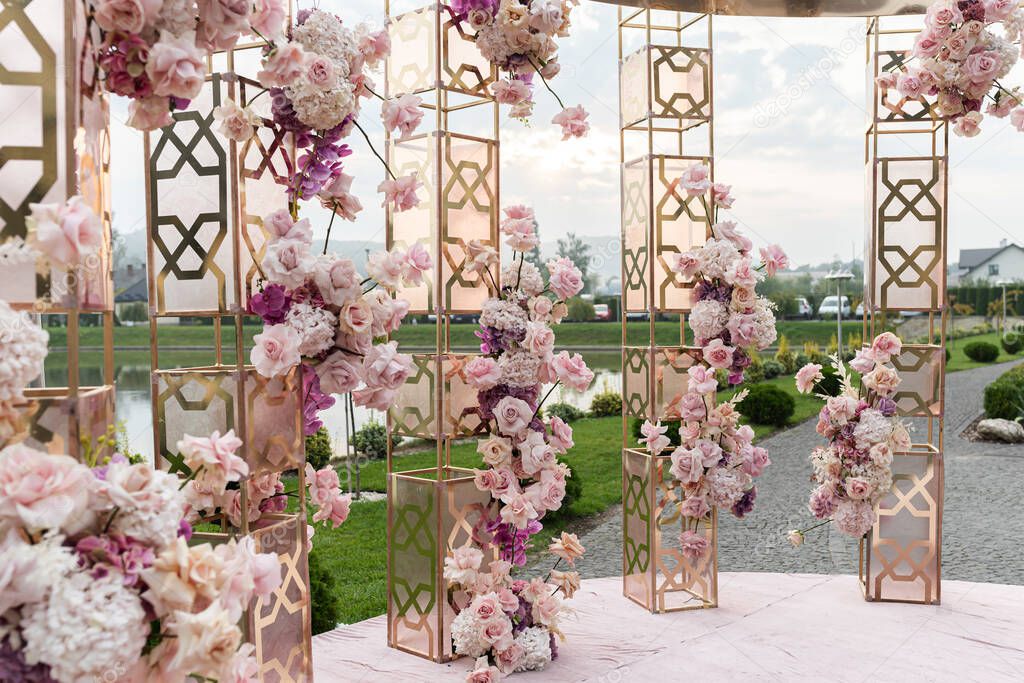 wedding set up with beautifil flowers, outdoor. Water