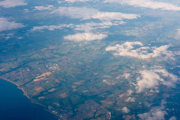 Land and sea seen from airplane — Stock Photo, Image