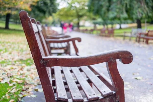 Benches along the way in Princes Street Gardens, the public space in city center of Edinburgh.