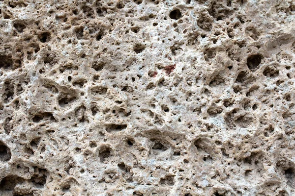 Дощовий вірменський туф, травертин. Пористий камінь з великими заглибленнями. Tuff Stone Sawn Cut Callibrated Tiles from Armenia. Ararat Classic Travertin Зображення для вашого дизайну. — стокове фото