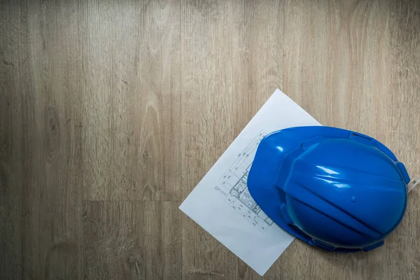 Safety blue helmet and home construction plan in dark abstract tone, architecture or industrial equipments, with copy space, engineering concept — Stock Photo, Image