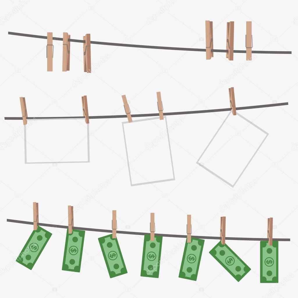 Dollar bills hanging on rope attached with clothes pins.