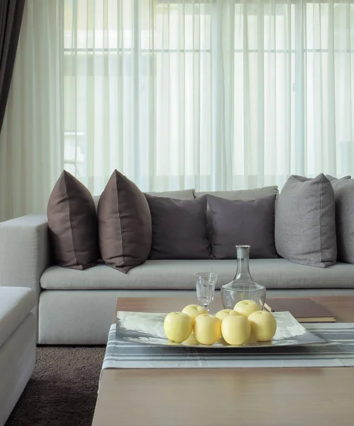 Fruits on tray with beige sofa in the living room — Stock Photo, Image