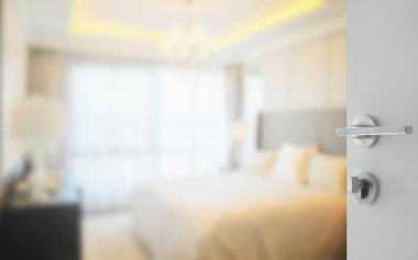 Arka plan olarak modern yatak odasına açılan beyaz bir kapı.