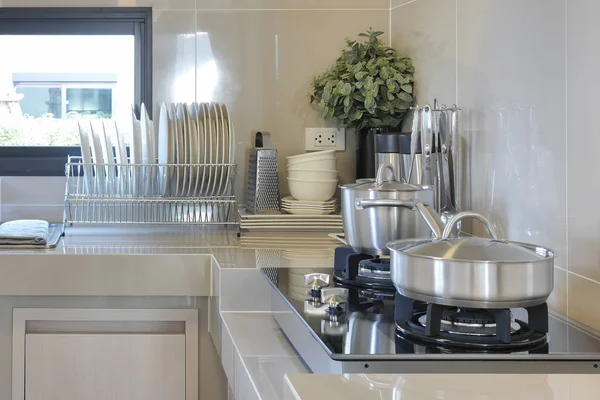 Stainless pan on gas stove with utensil in modern kitchen — Stock Photo, Image