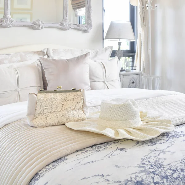 Decorative set with vintage bag,hat,books on bed in luxury bedroom interior — Stock Photo, Image