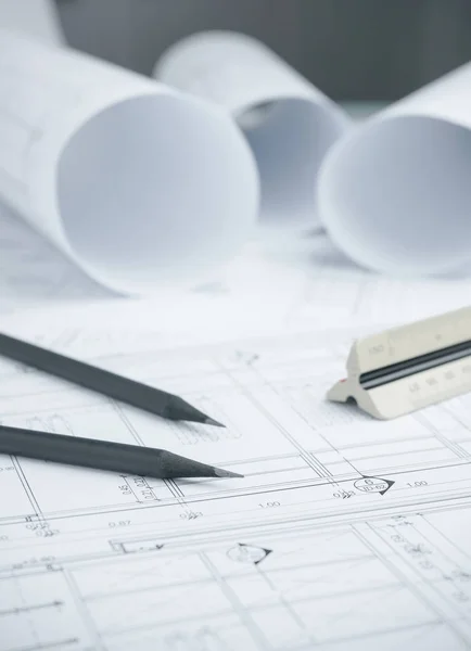 Black pencil on architectural drawing paper and rolls for construction — Stock Photo, Image