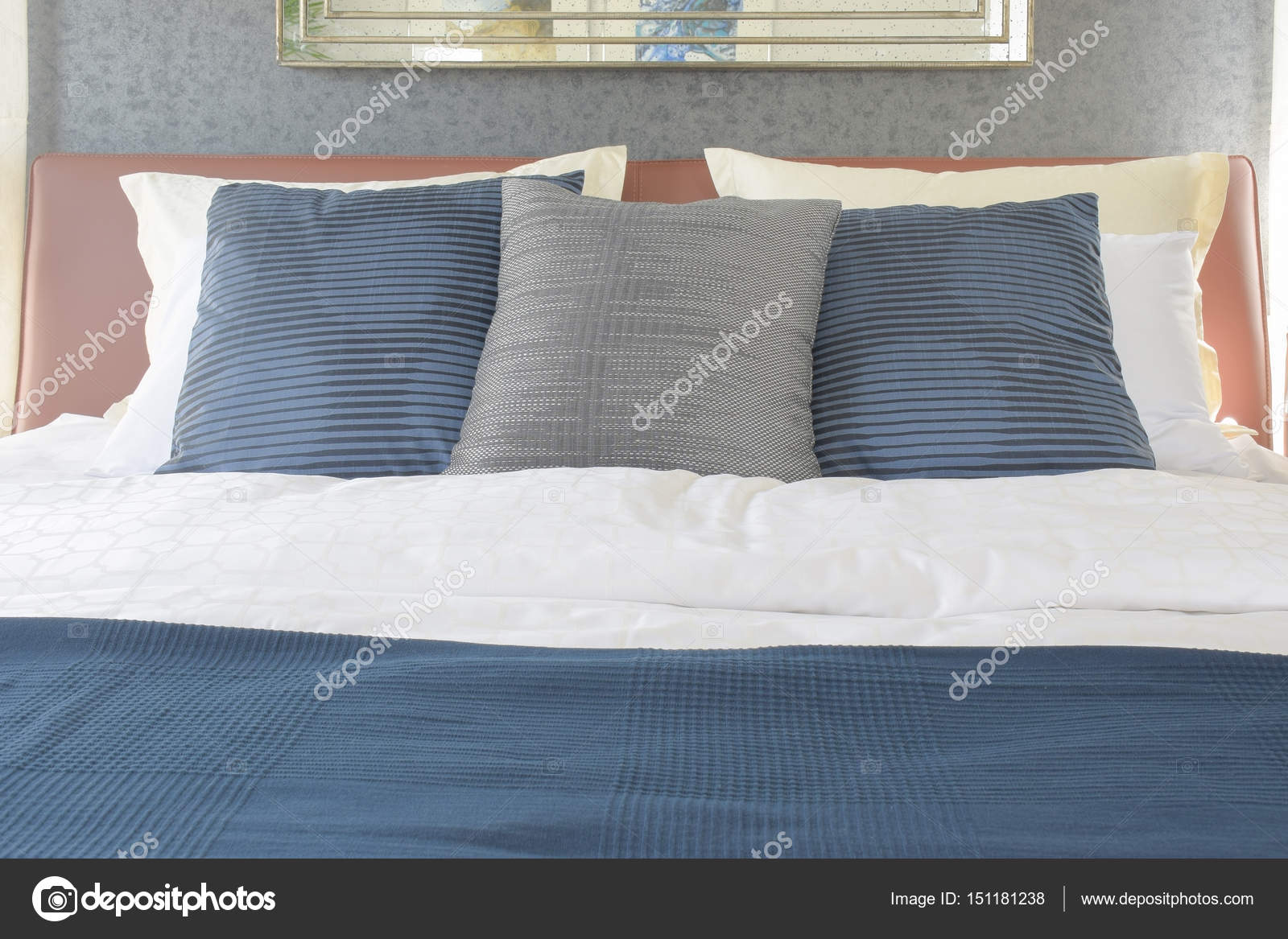 Dark Blue And Gray Pillow On Bed With Brown Leather Headboard Stock Photo Image By C Worldwide Stock 151181238