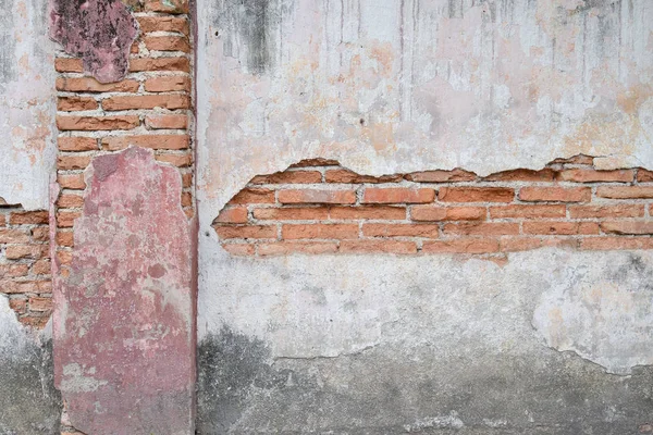 Old masonry wall crack with brick wall background