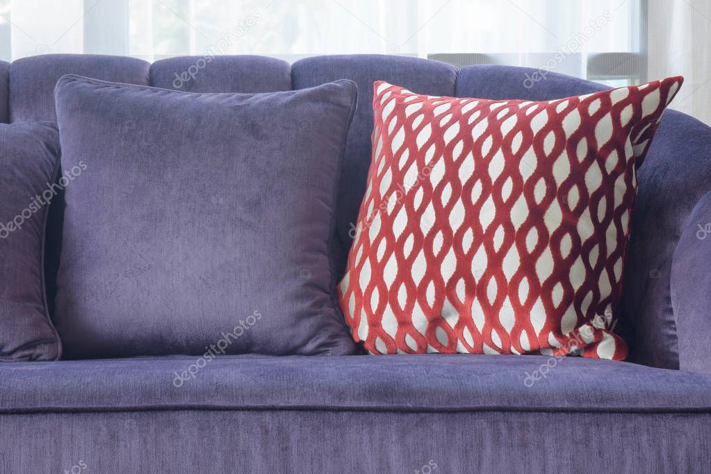 Close up red crossed pattern pillow with violet sofa set