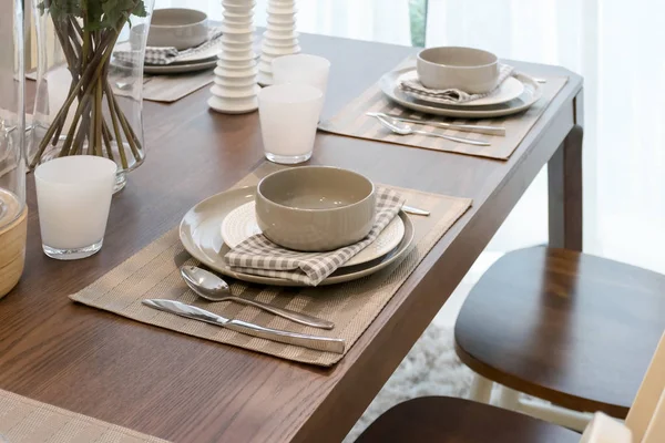 Modern dininig room interior with table set on wooden table — Stock Photo, Image