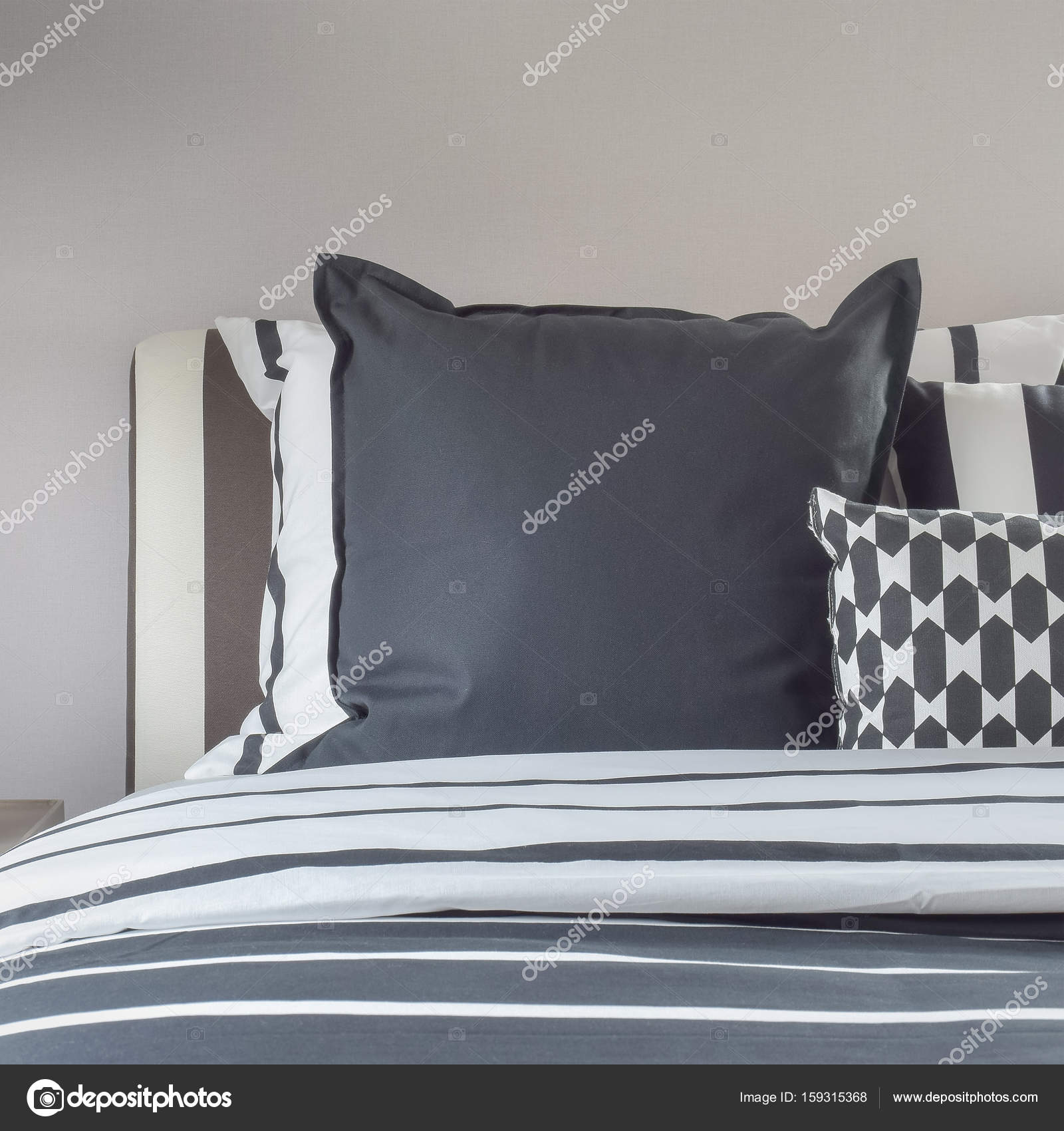 Modern bedroom interior with black and white pillows Stock Photo by ...