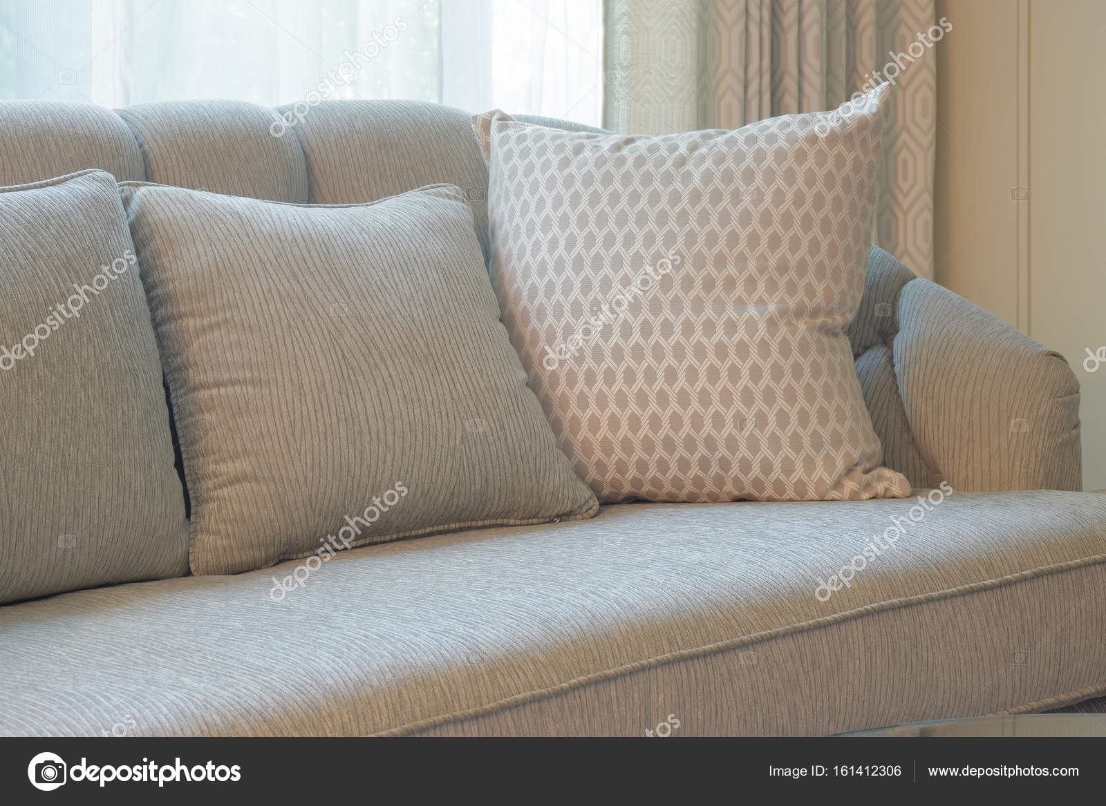https://st3.depositphotos.com/6200870/16141/i/1600/depositphotos_161412306-stock-photo-comfy-sofa-with-pillows-in.jpg