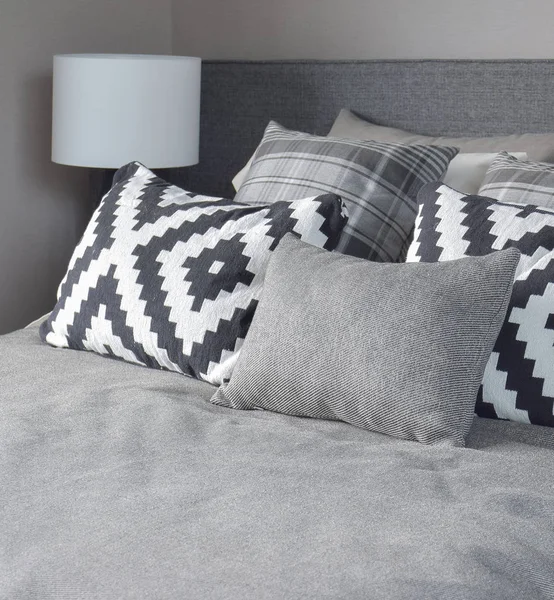 Graphic style and grey shade pillows on classic color bedding set up — Stock Photo, Image