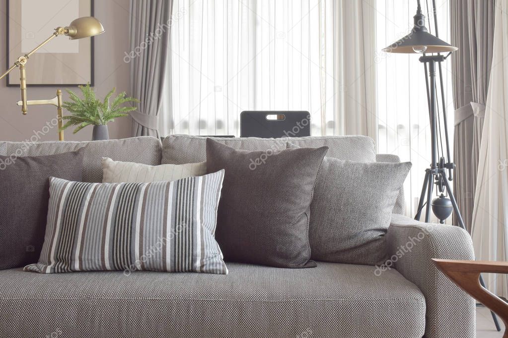 Classic style of pillows and sofa in grey tone color