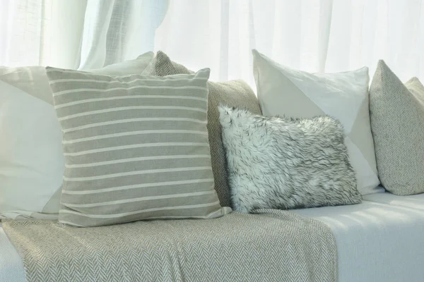 Brown color scheme pillows setting on sofa in living room — Stock Photo, Image