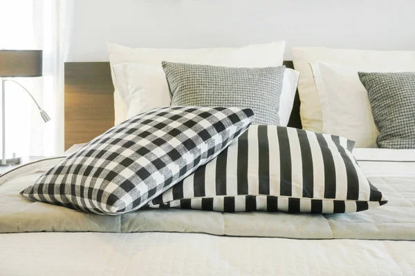 Black and white checked and strip pattern setting on bed — Stock Photo, Image