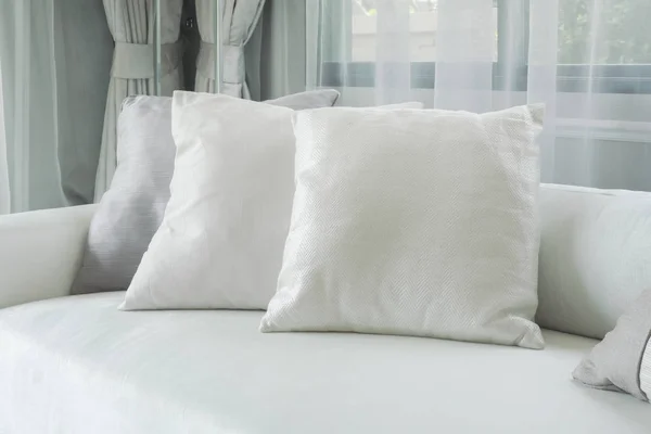 White pillows lay on sofa in modern style living room