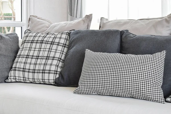 Modern living room interior with black and white checked pattern pillows on sofa — Stock Photo, Image