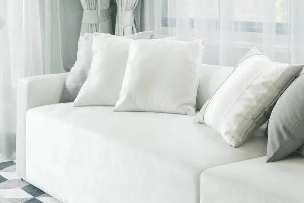 White pillows lay on sofa in modern style living room