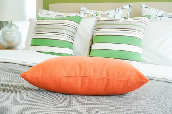 Closeup orange pillow on bed — Stock Photo, Image