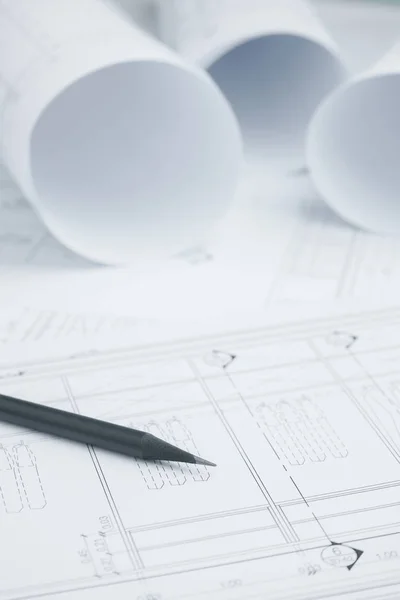 Black pencil on architectural drawing paper and rolls for construction — Stock Photo, Image