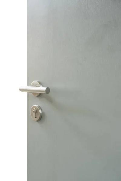 Aluminium door knob or door handle on the white door — Stock Photo, Image