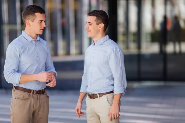 stock image Two businessman talking about business on they break with  coffe