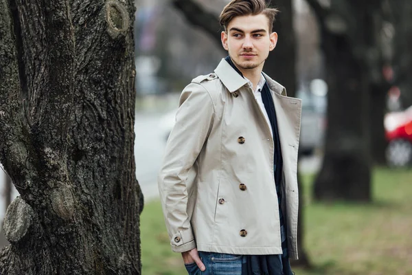 Fashionable man standing outdoors with white background — Stock Photo, Image