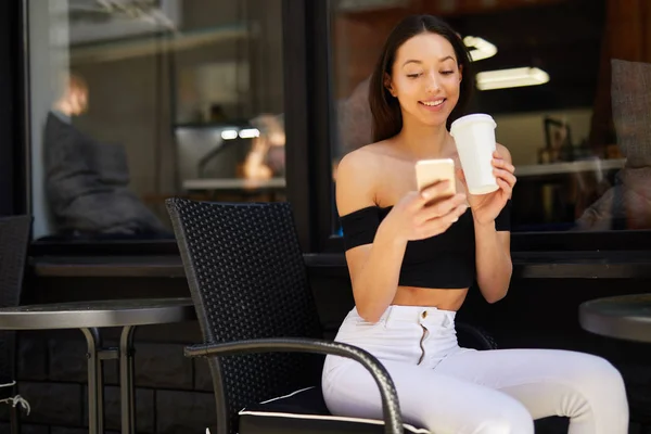 Girl with coffee and phone