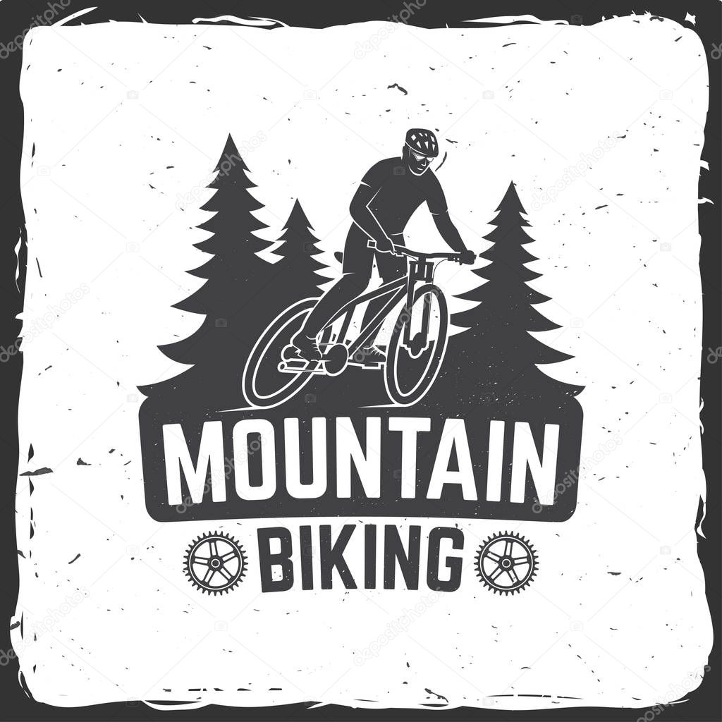 Vintage typography design with man riding bike and forest silhouette.