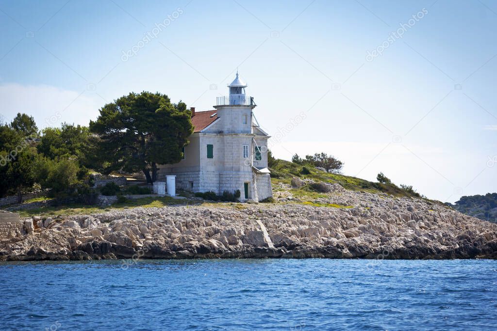 View of a lighthouse on the Adriatic coast. It stands on an island, right next to the Kornati Islands, Croatia.