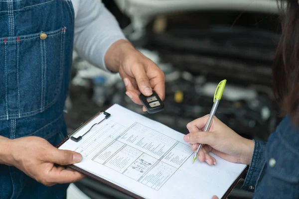 car salesman is making deal with lender. Used cars cheaper than