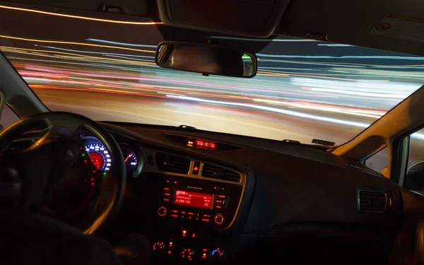 Night driving, view from inside car.