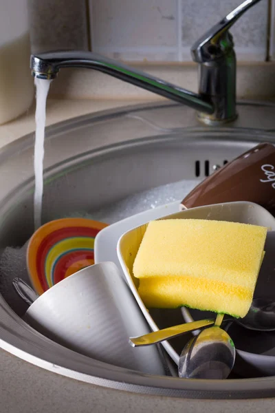Sink full of washing dishes — Stock Photo, Image