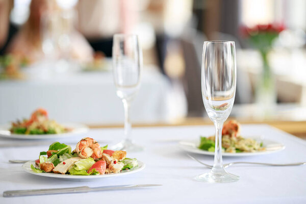 Delicious fresh salad with shrimps in restaurant