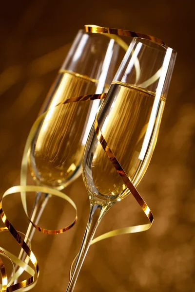 Gold scenery with two glasses of champagne for celebration important moments.
