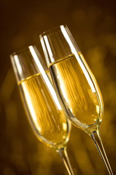 Gold scenery with two glasses of champagne for celebration important moments.