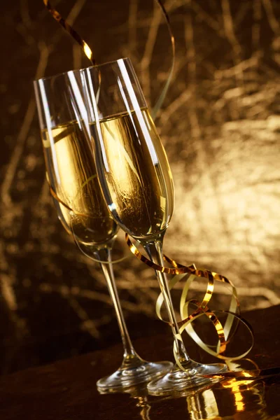 Gold scenery with two glasses of champagne for celebration important moments.