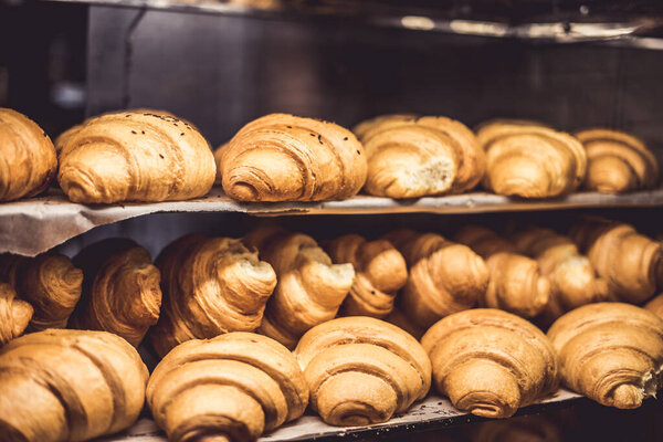 Delicious croissants on the store showcase of the bakery house