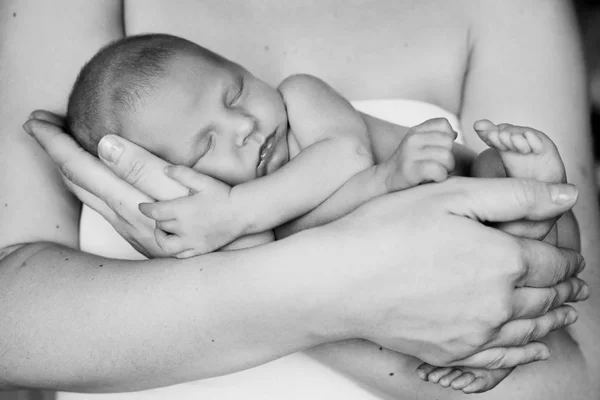 Mother holding her little newborn baby Stock Photo