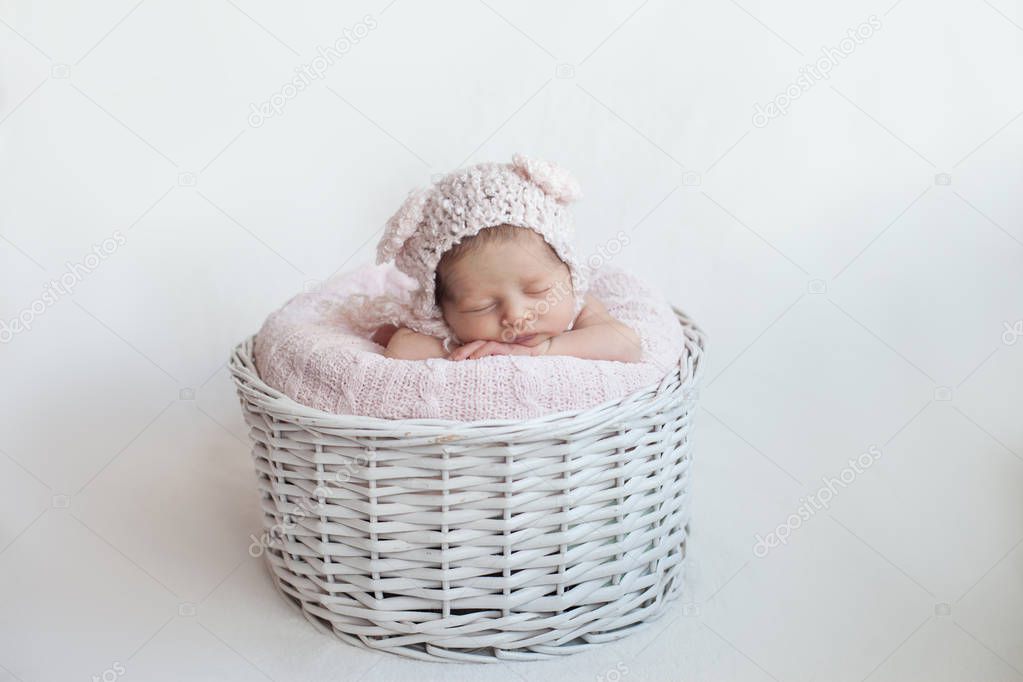 Newborn baby asleep in basket