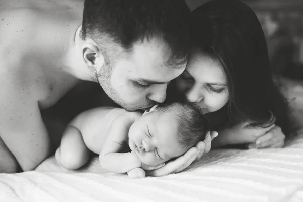 Family holding  sleeping newborn — Stock Photo, Image