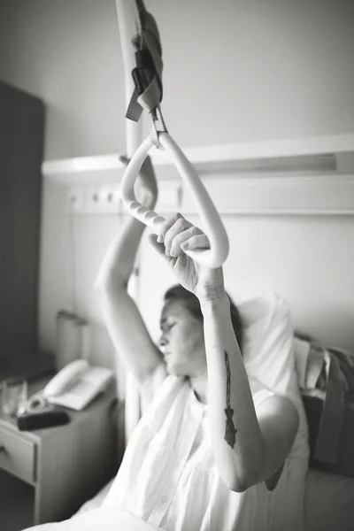 Young woman before giving birth in a hospital