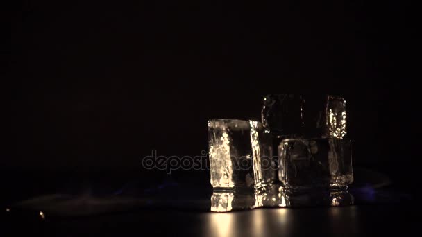 Burning alcohol with around ice cubes — Stock Video