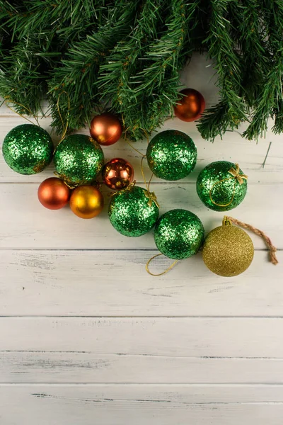 Holiday New Years decorations. Christmas tree with many green and red balls near — Stock Photo, Image