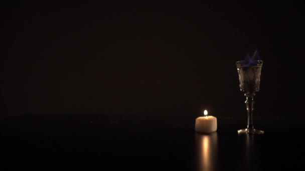 Sambuka che brucia e una candela — Video Stock