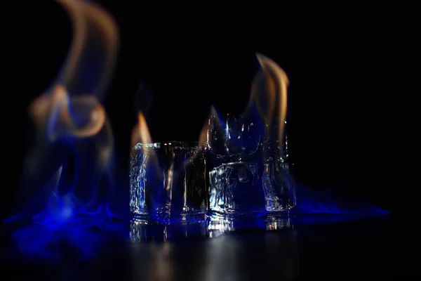 Burning ice pyramide in the dark — Stock Photo, Image