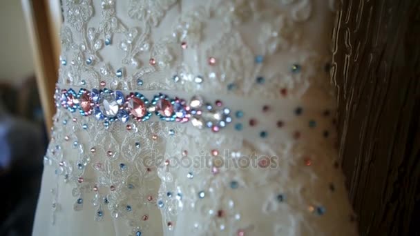 Blue and pink crystlas decorate belt of wedding dress — Stock Video