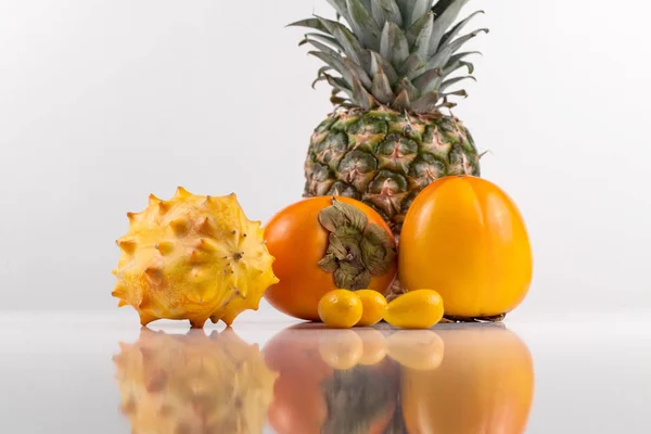 Tropical ripe fruits placed on a white background in studio — Stock Photo, Image
